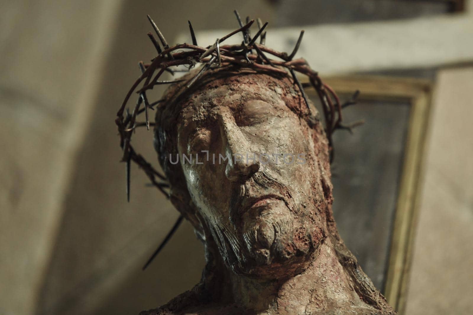 A statue of Jesus hanging on a cross in a church