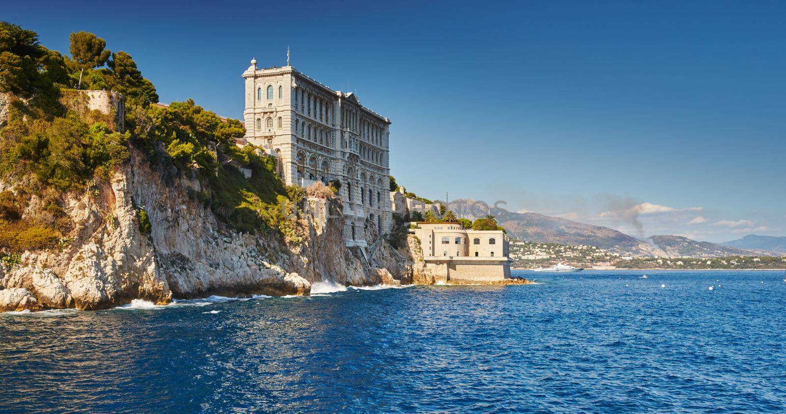 Oceanographic Museum of Monaco at sunset, Oceanographic Institute, Monaco Ville, mountains on background. High quality photo