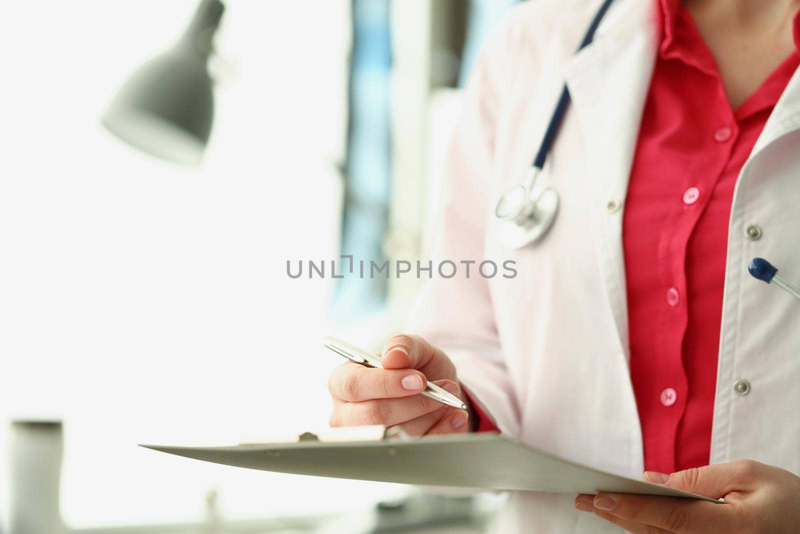 Close-up of qualified doctor fill in prescription for patient and list needed medication. Intern on day shift in clinic. Medicine, save life, help concept