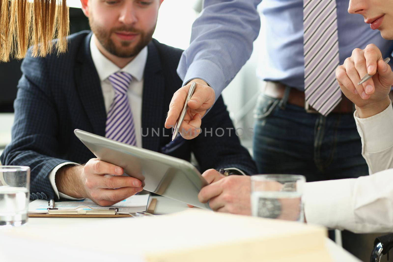 Portrait of smart businesspeople making decisions in company, manager showing finance statistics to group. Company or business meeting, development concept