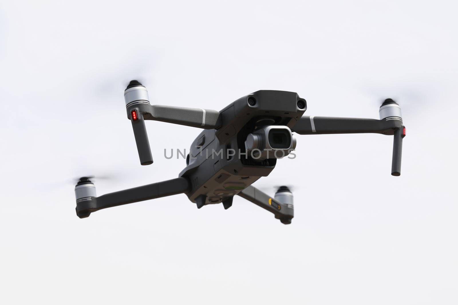 Close-up of brand new drone device with remote controller fly and filming. Modern drone gadget, digital camera, modern technology, entertainment concept