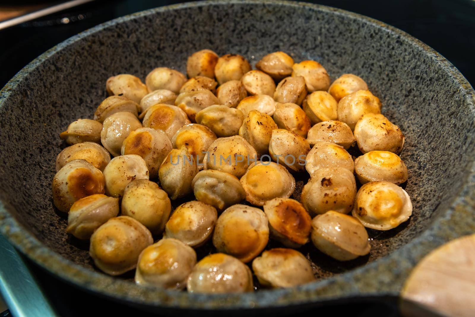 Fried meat dumplings fried on the pan. traditional russian cusine.