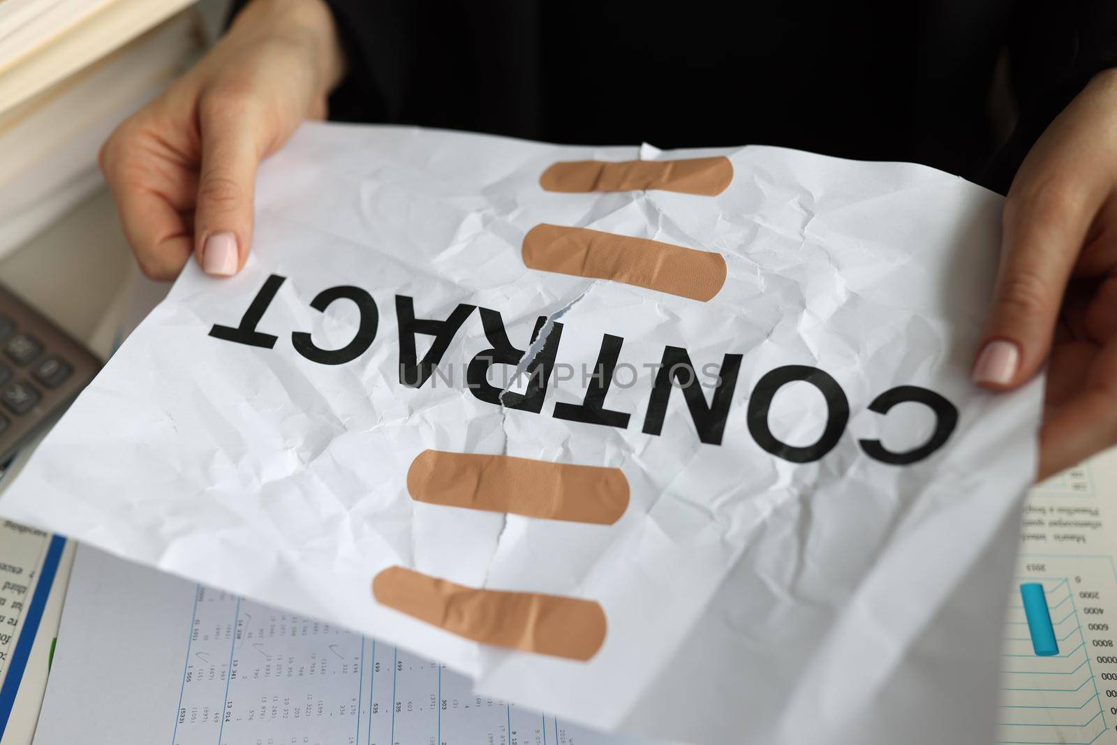 Manager hands holding band-aid paper contract closeup. Difficulties in finding employment concept