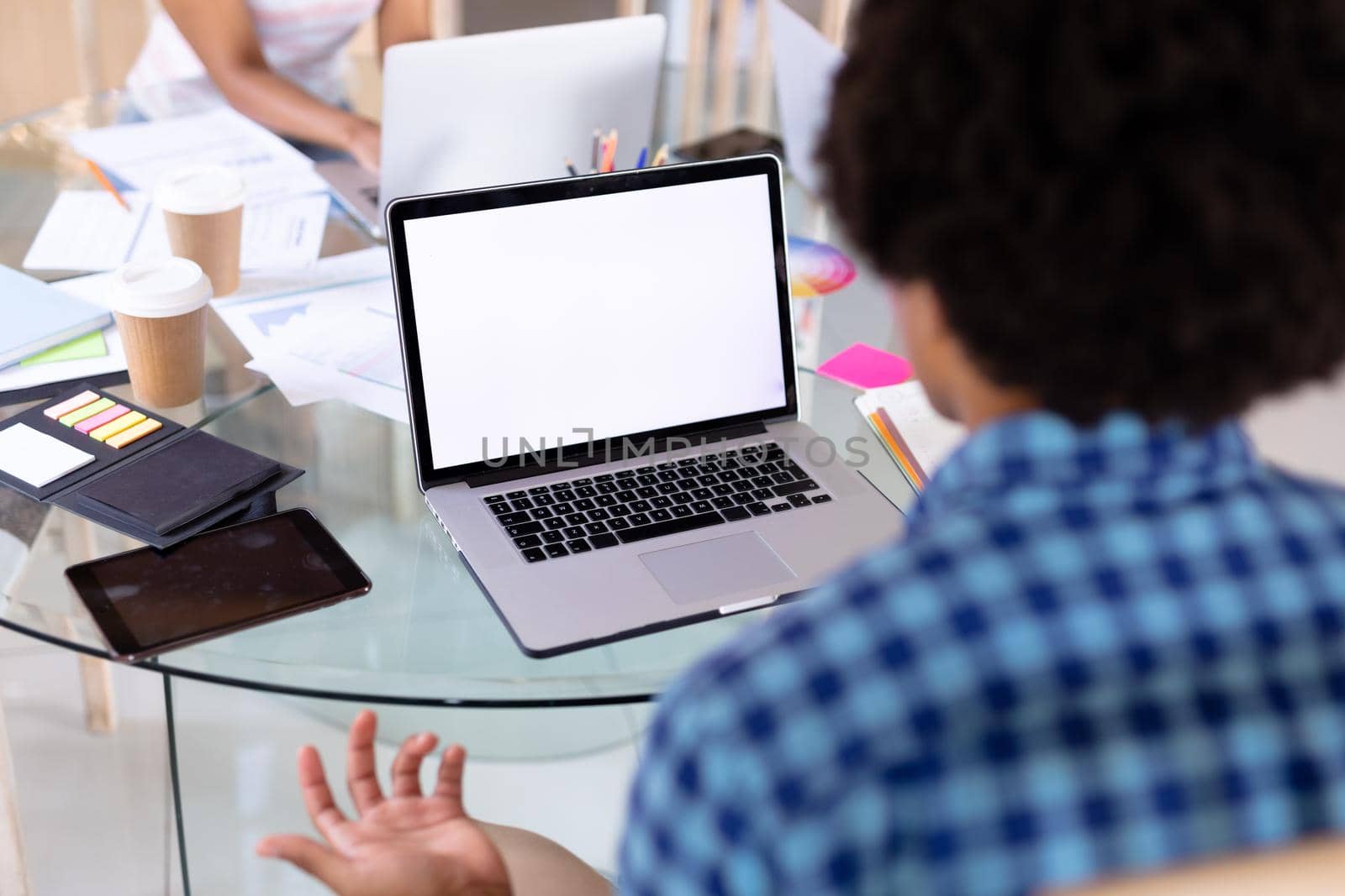 Biracial freelancer on laptop video call with copy space on blank screen at home office by Wavebreakmedia