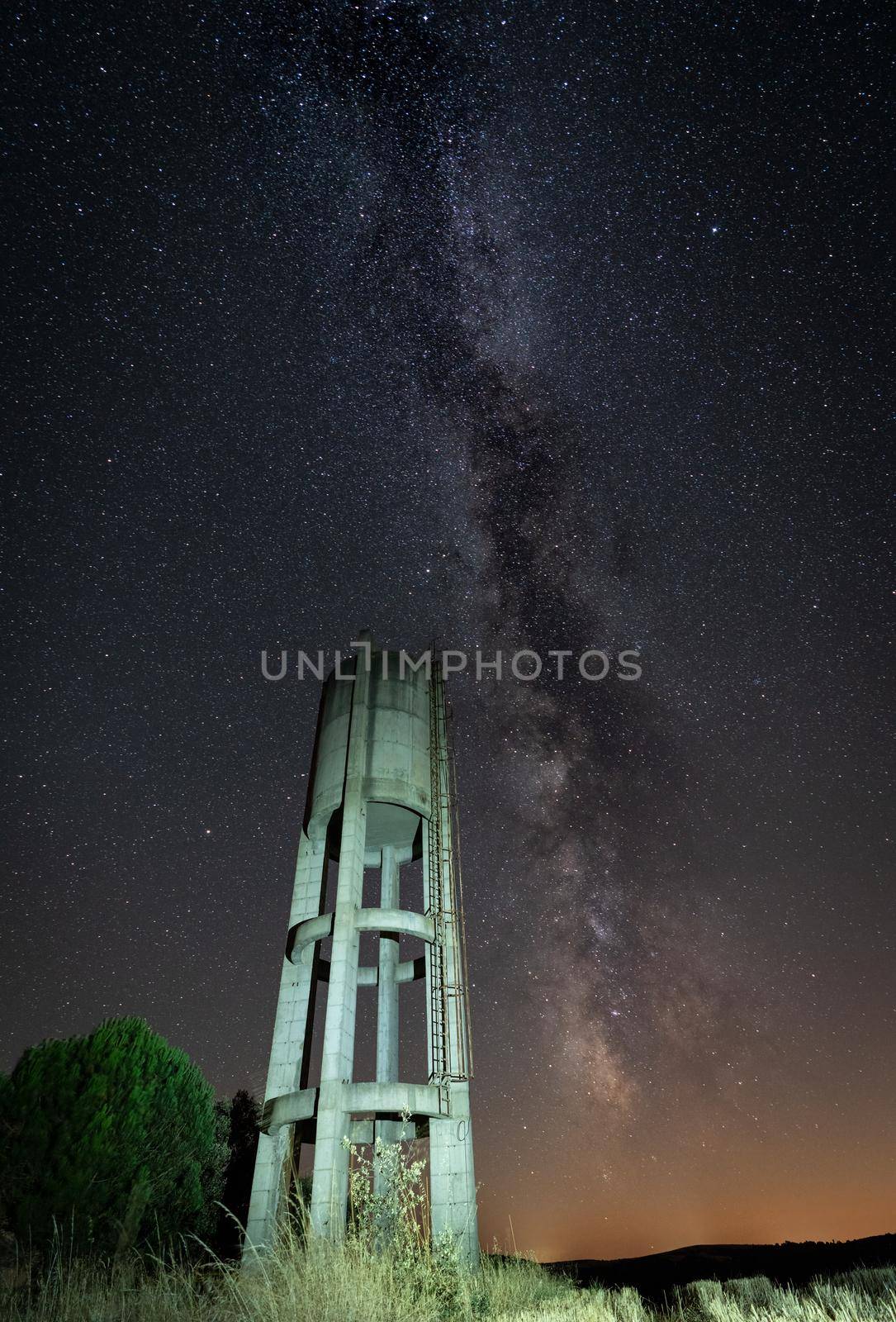 Rusty concrete water Tank under the stars by FerradalFCG