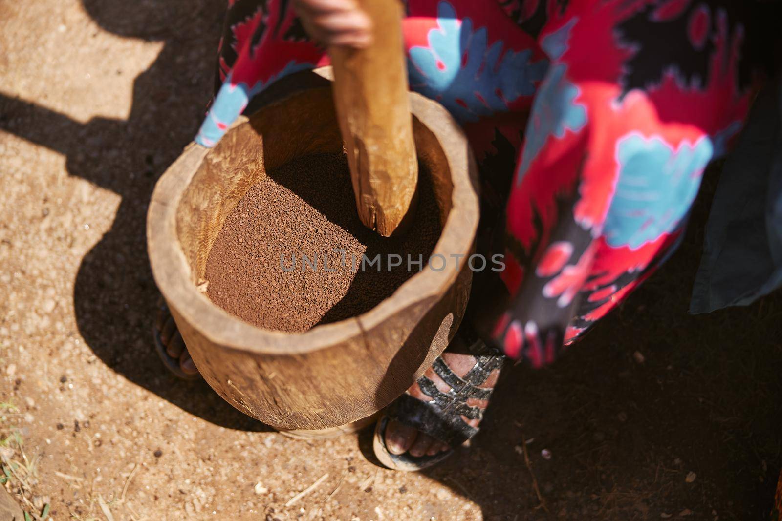 african workers are picking out fresh coffee beans at washing station