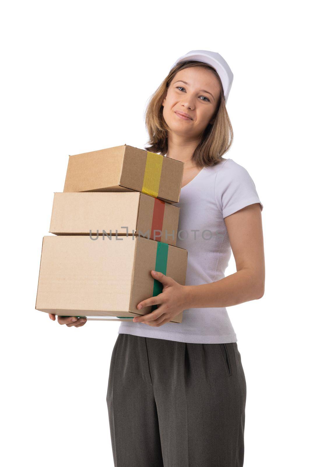 Portrait of delivery woman in white cap, t-shirt giving order boxes isolated on white background. Female courier step, cardboard box. Receiving package.