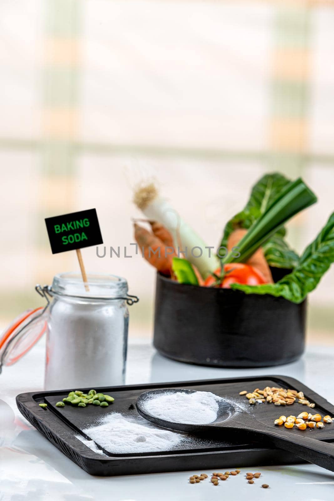 Bicarbonate surrounded by fruits and vegetables on a white background, view from above