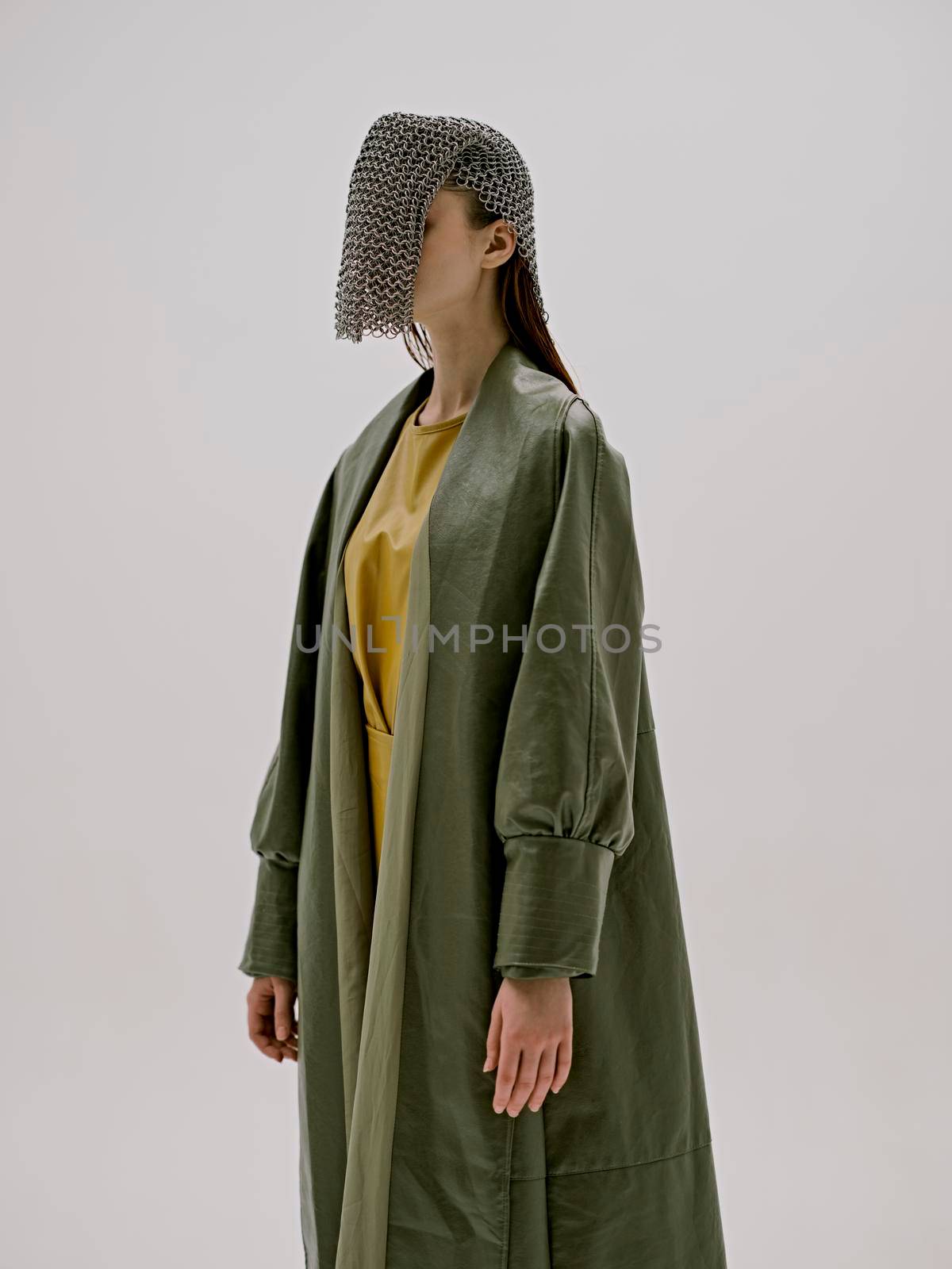 photo pretty woman in a green coat with chain mail on his head unaltered by SHOTPRIME