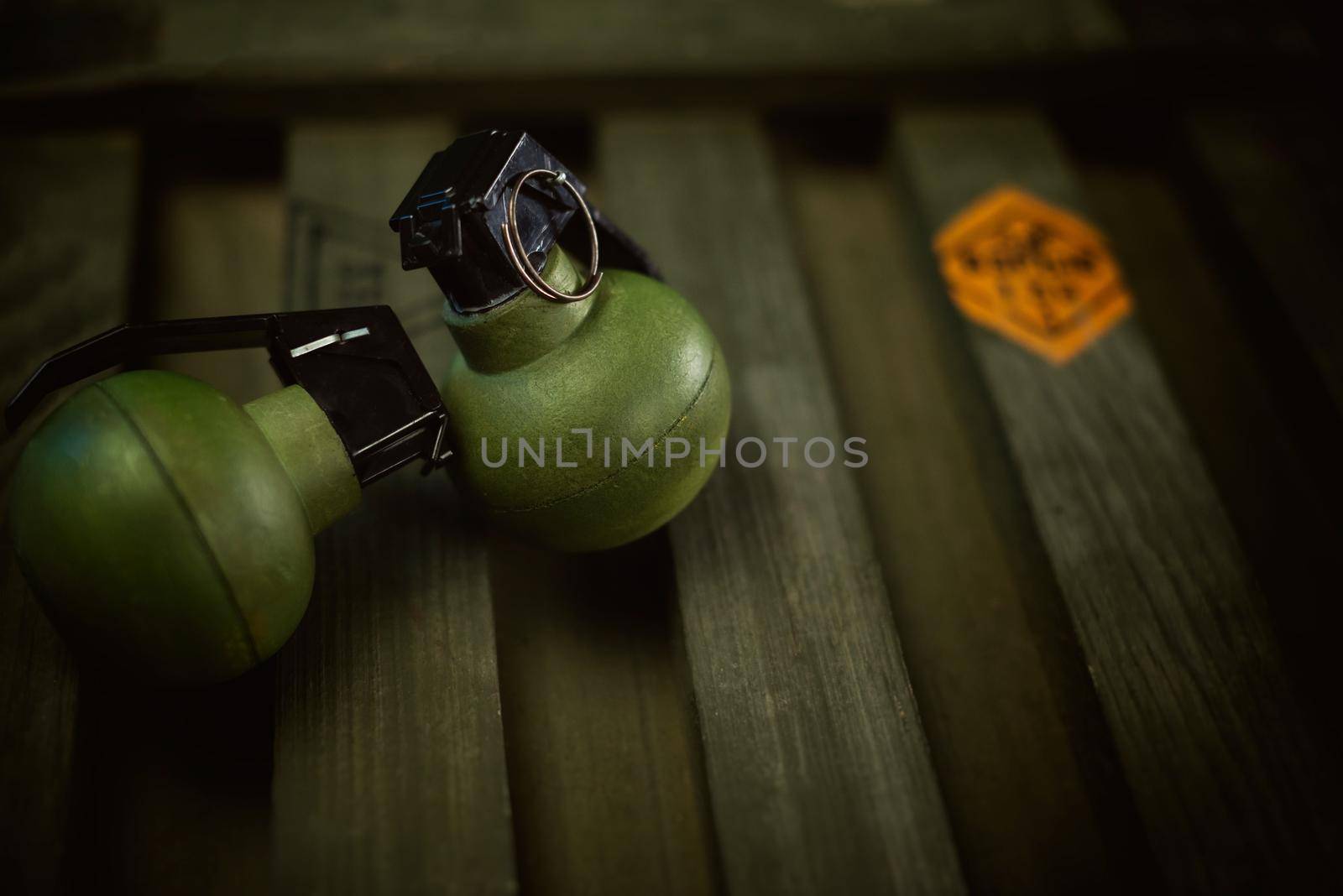 explosive grenades on the background of a wooden weapon box by Rotozey