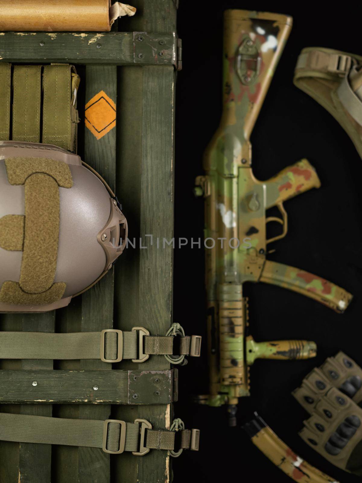 military ammunition top view of a grenade box, rifle, grenades, bulletproof vest, helmet and other tactical items by Rotozey