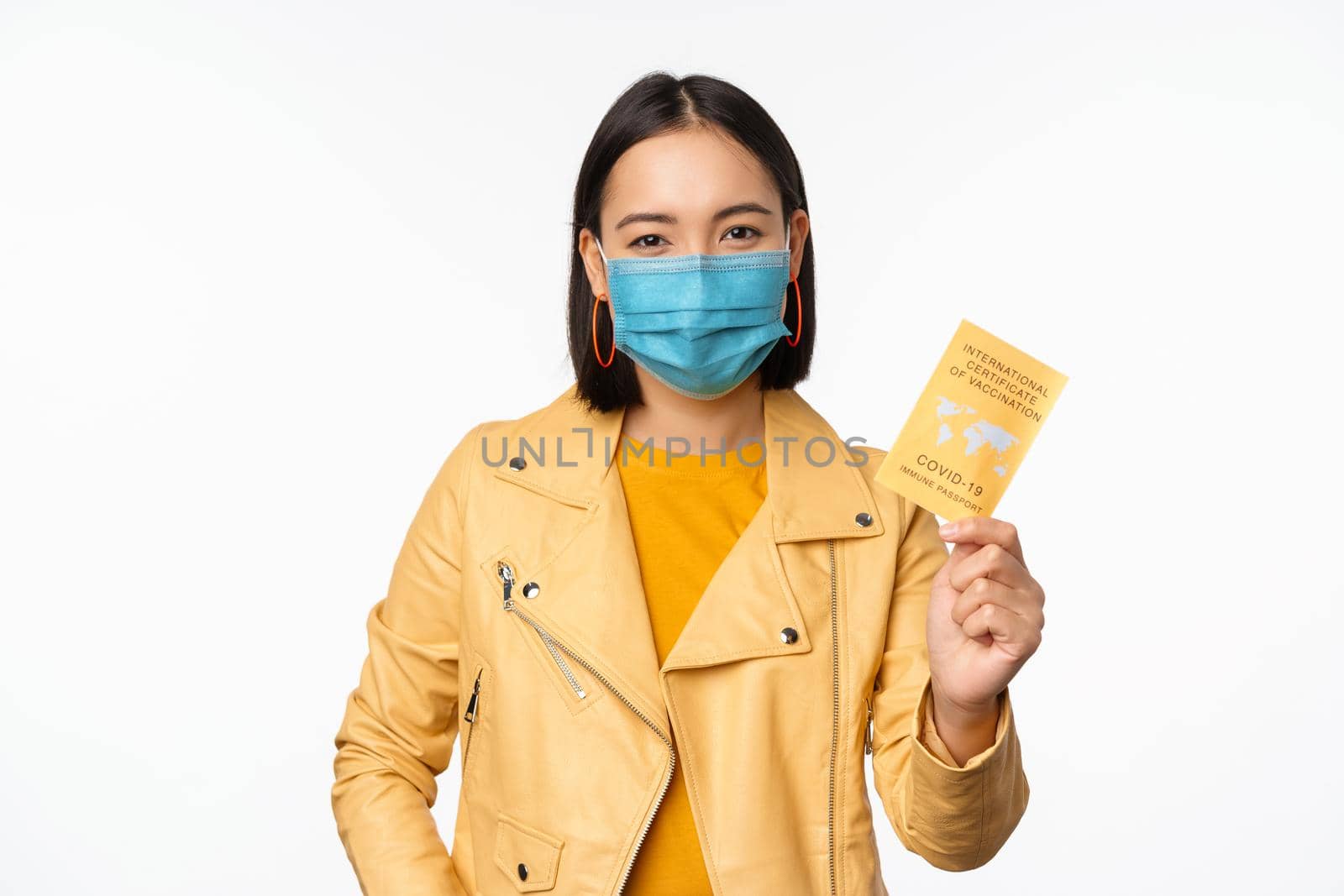 Hey you got point. Cheerful cute asian lively girl dark short haircut pointing camera finger-pistol smiling broadly, encourage friend make move, congratulate coworker good job, stand blue background by Benzoix