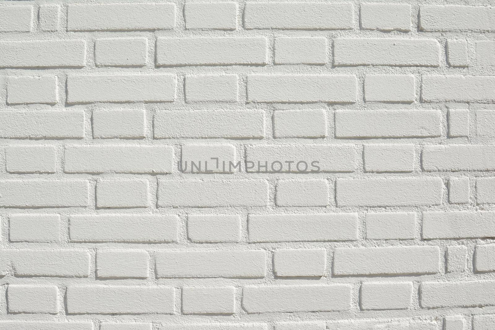 White brick wall background and texture Sun day