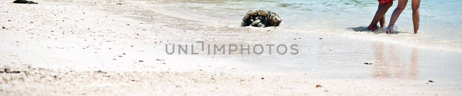 Tourists stand at beach