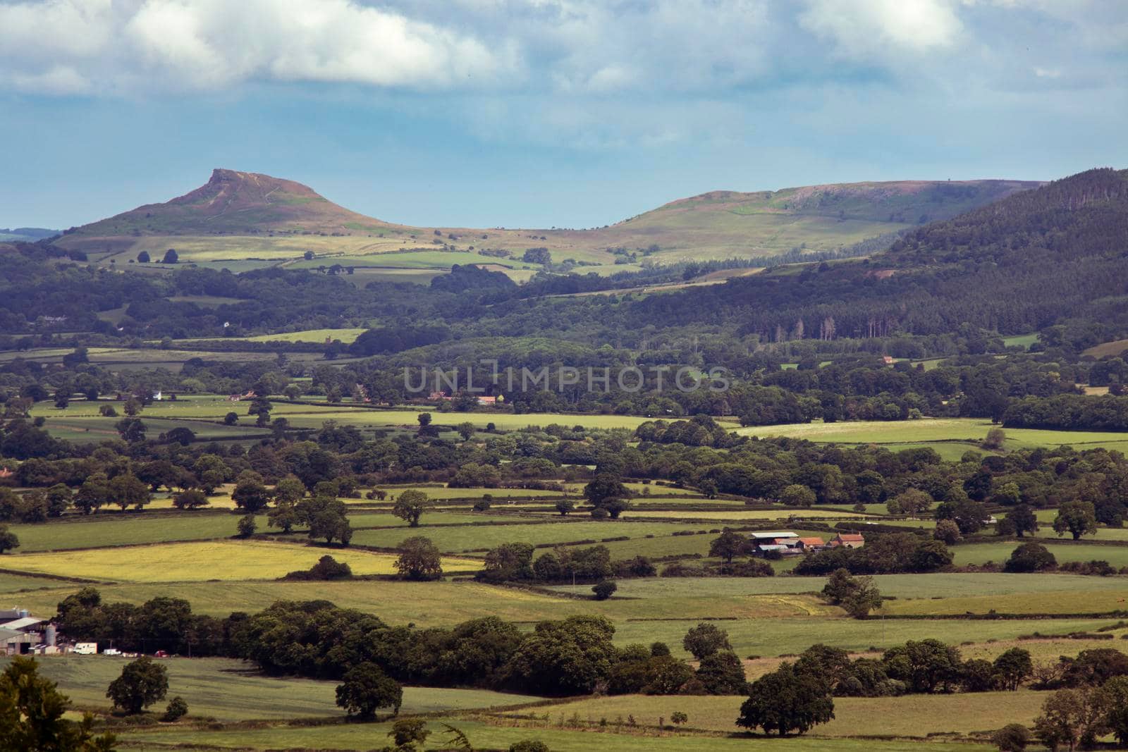View over patchwork fields in North York Moors with clouds by StefanMal