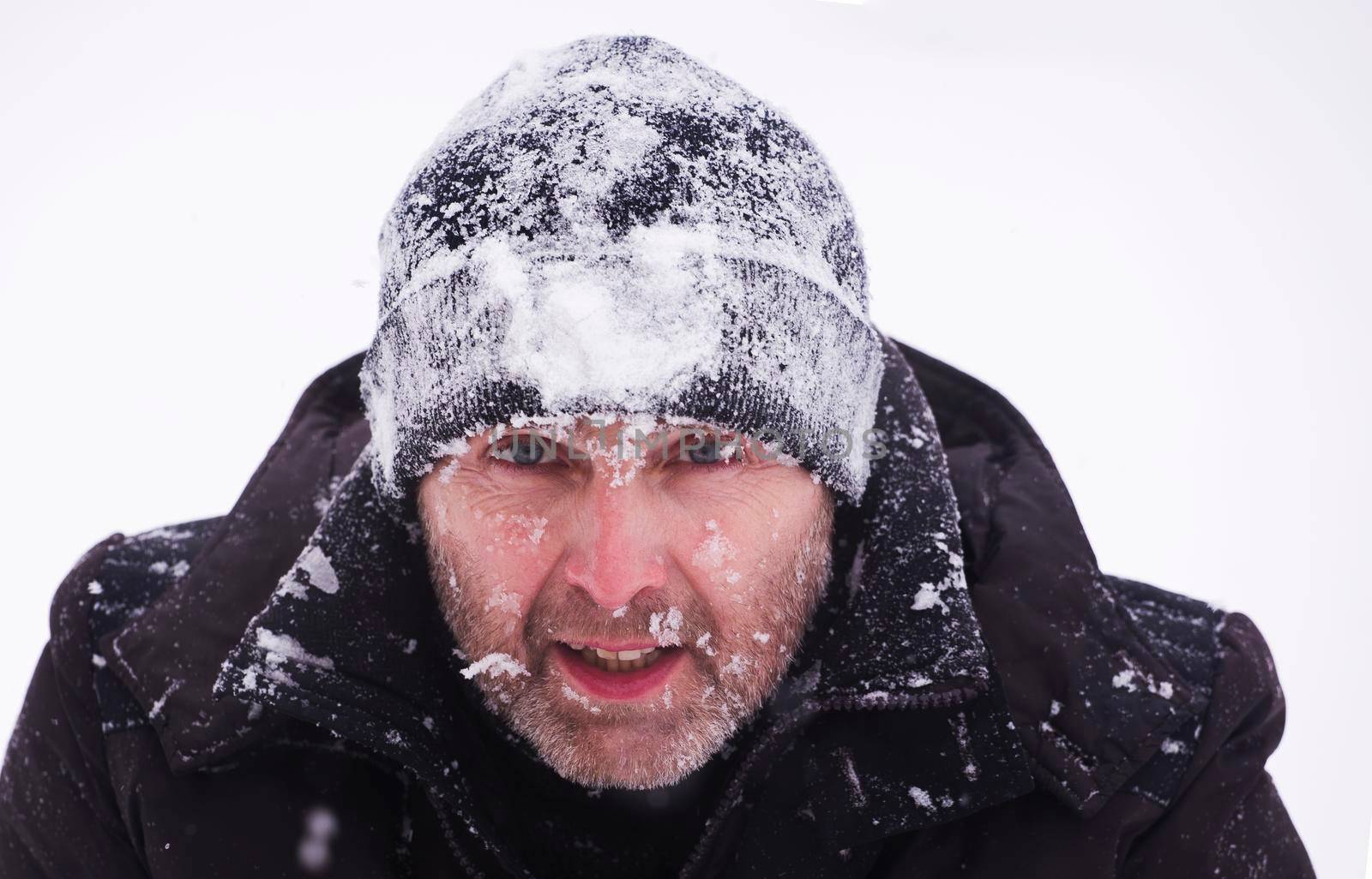 Portrait and photography of people from the side. Portrait of a tourist during a storm and snowfall.