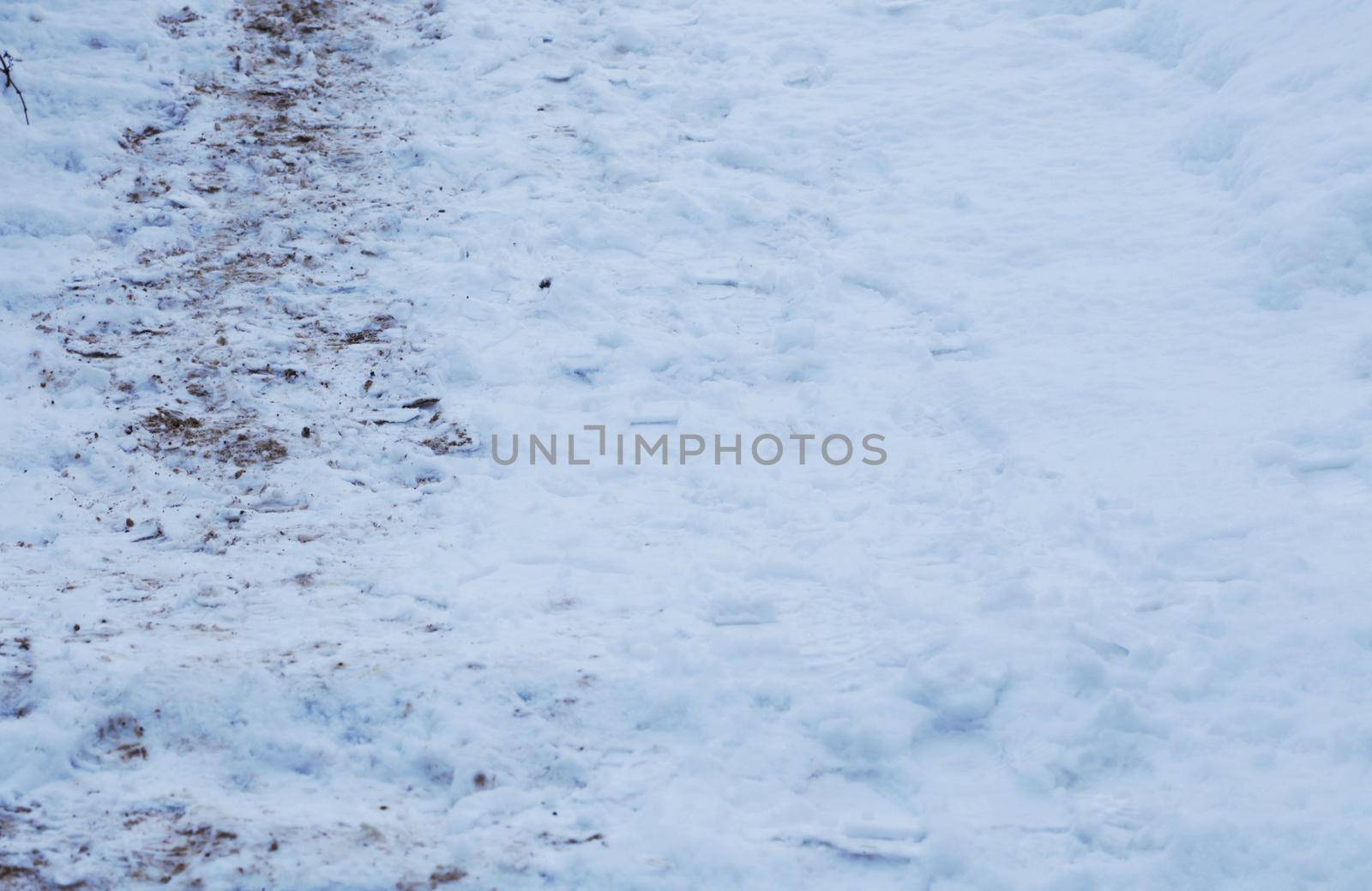 Stairs in the snow. Footprints in the snow.