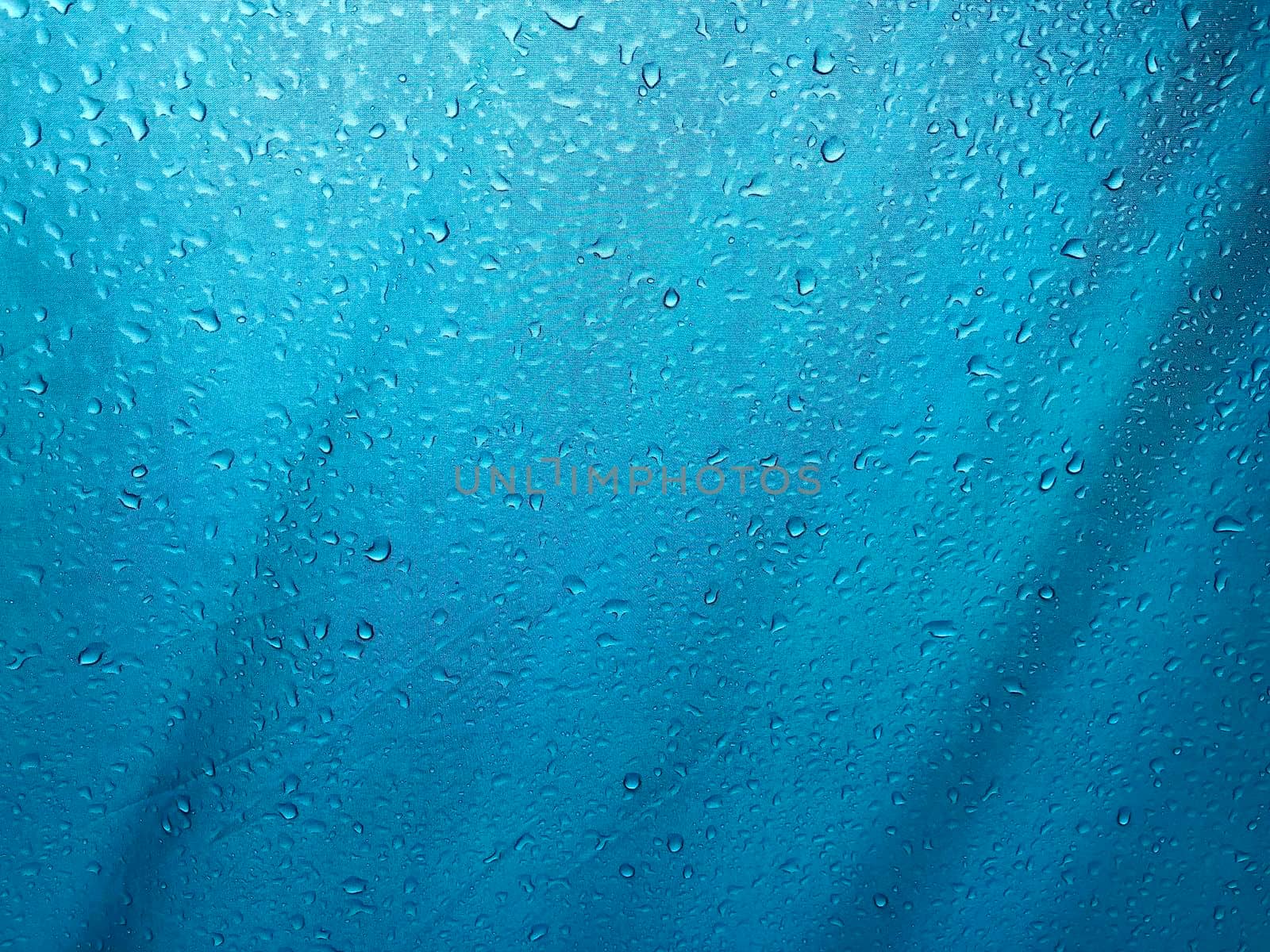 Drops down on the blue canvas floor. Abstract background