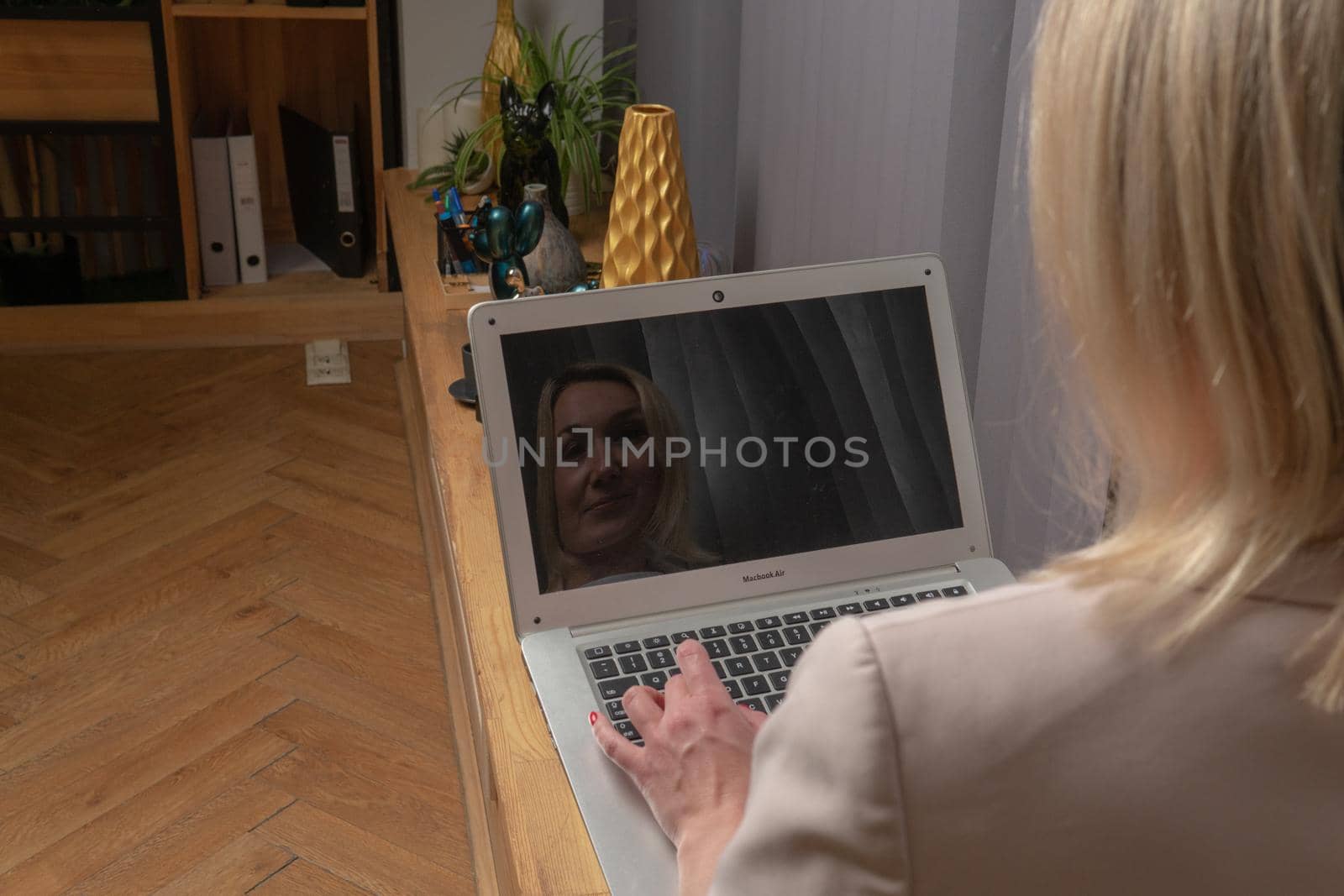 Girl typing in a laptop in a white business lady suit, a concept independent feminist woman laptop home student education, for online webinar from female from people sitting, internet desk. Eenage digital working, connection