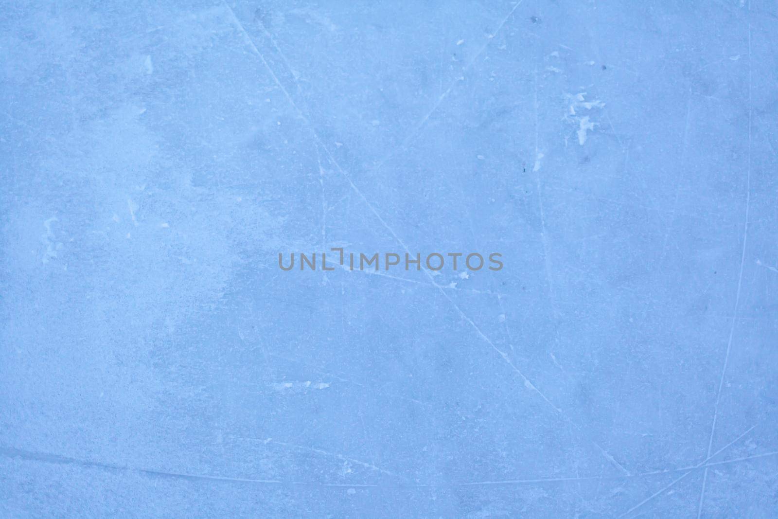 Empty ice rink with skate marks after the session outdoor. by AnatoliiFoto