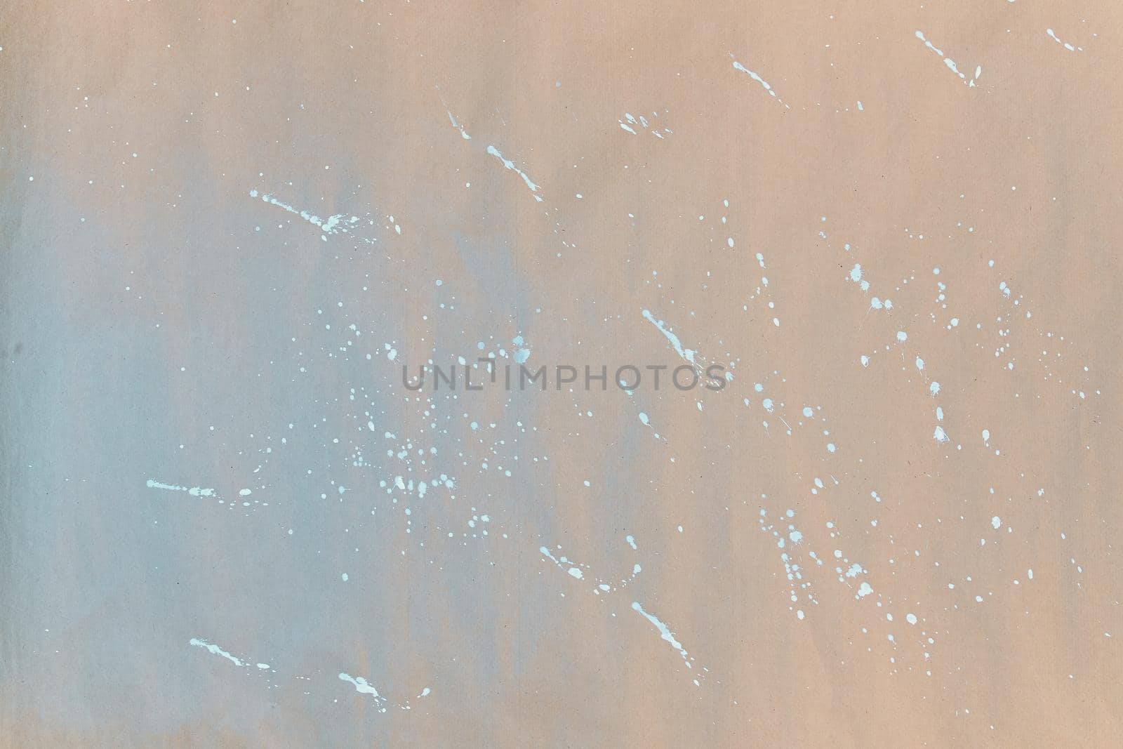 Texture of gift wrapping paper. Abstract drawing on craft paper for surprises. White splashes and paint splatters.