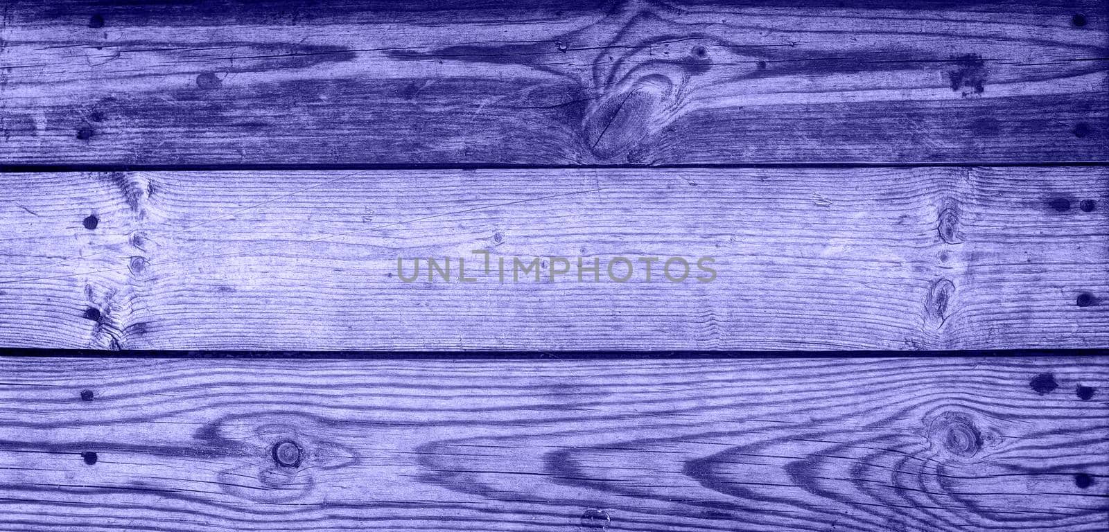 Lilac background - an old dark wood texture, with a horizontal pattern of wood. Copy space. Banner