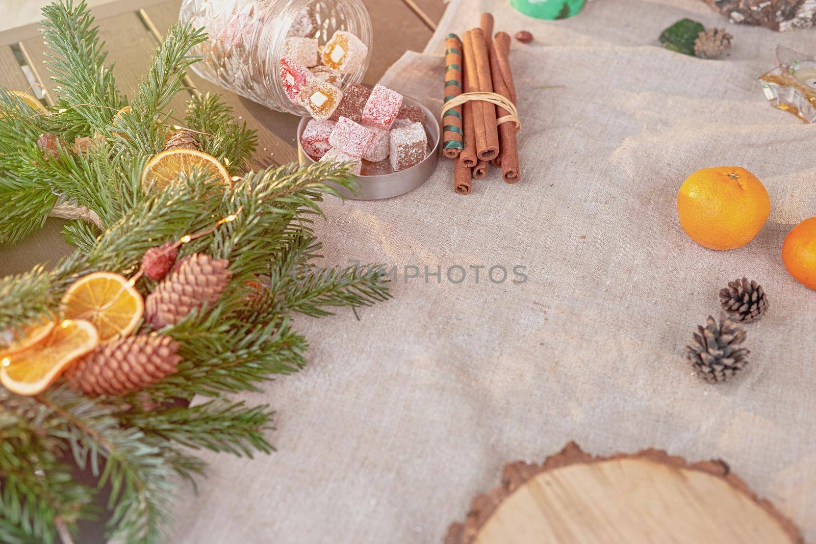 Beautiful natural spruce wreath on a fabric tablecloth by Zakharova