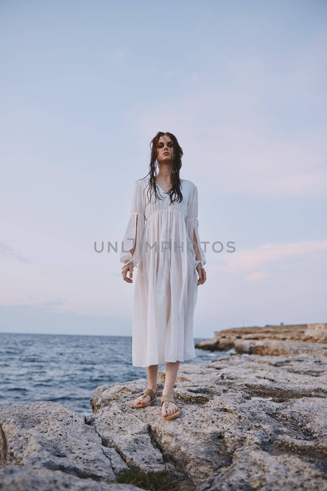 Beautiful woman white dress standing outdoor nature. High quality photo