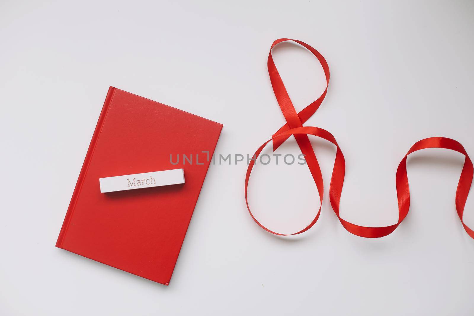 Eight made of red ribbon. 8 March greeting card template. International Women's day background, banner, poster