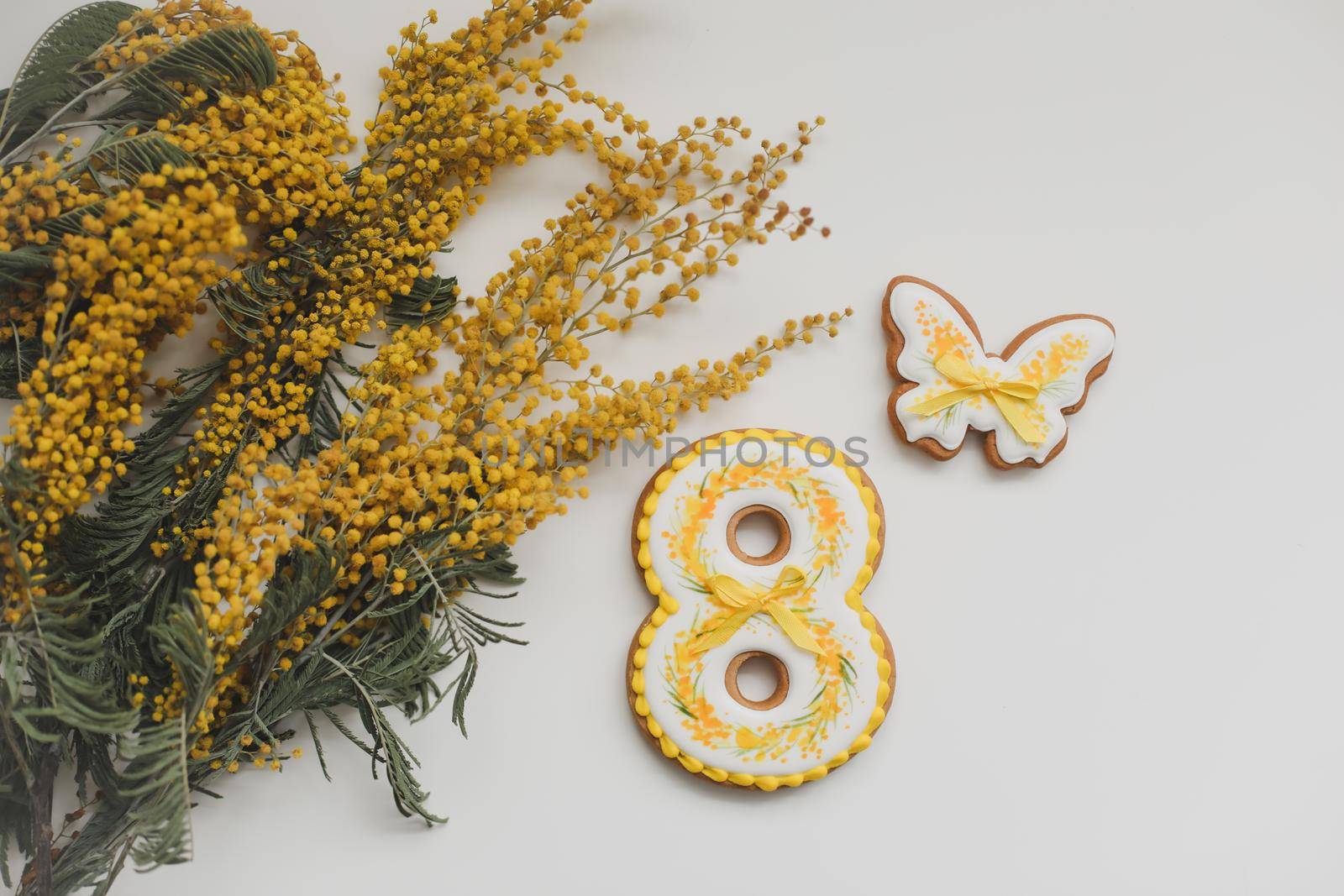 Women's Day, March 8, figure eight, gingerbread, flowers. Space for text. by paralisart