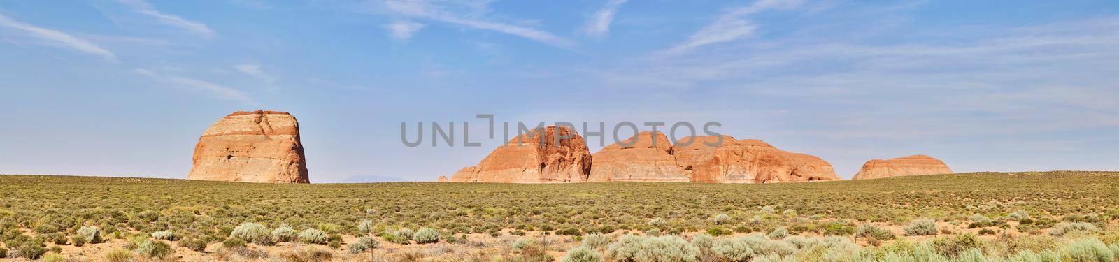 Panorama of red rock pillars on desert horizon by njproductions