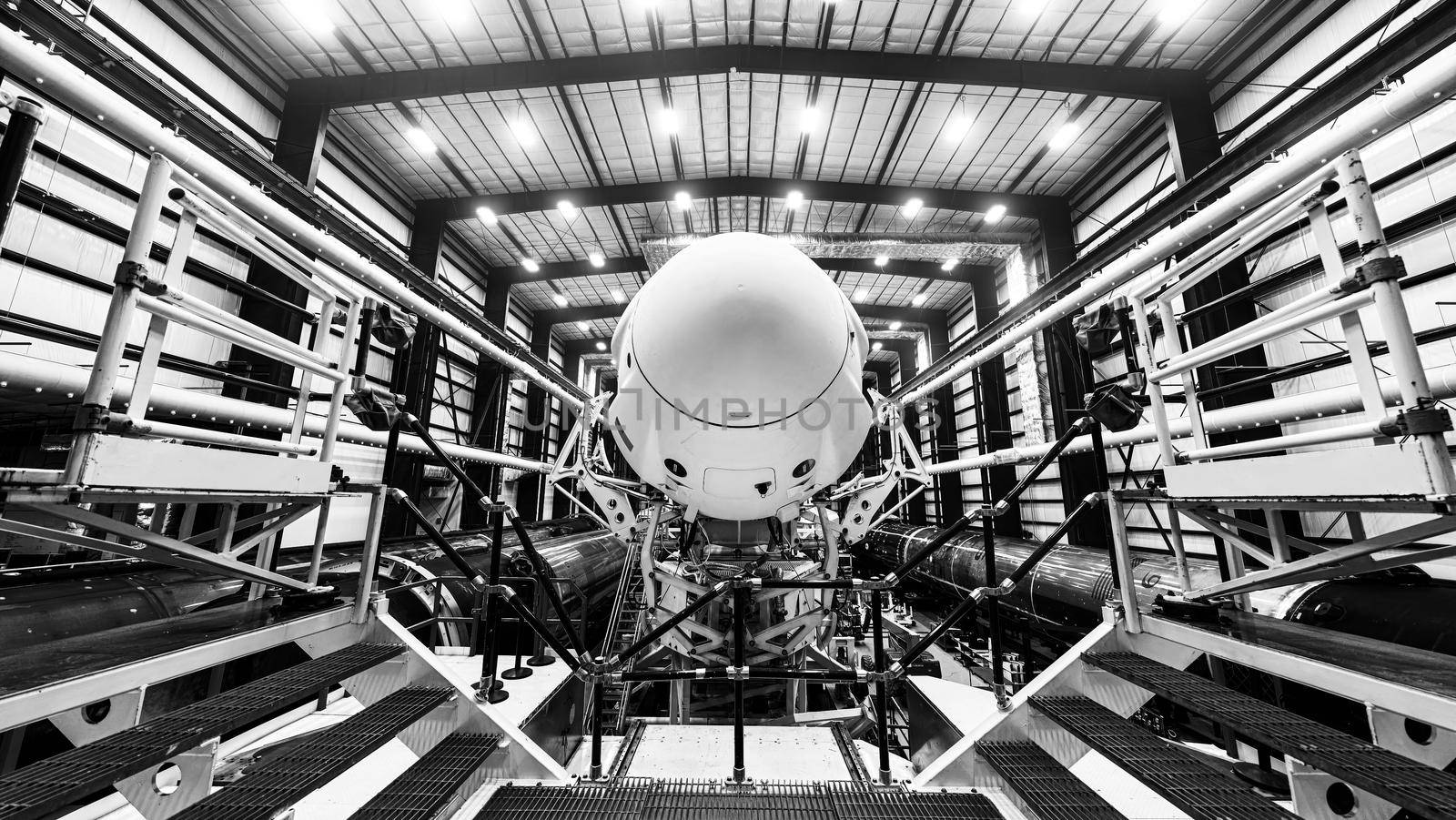 Space launch preparation. Spaceship atop the rocket, inside the hangar, just before rollout to the launchpad. Elements of this image furnished by NASA.