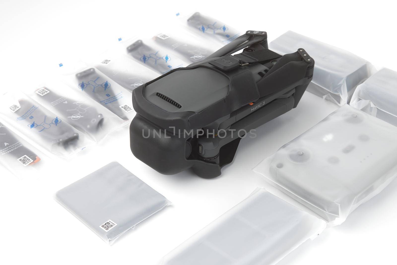 New DJI Mavic 3 drone on a white background when unpacking. Parts of the delivery set in the original packaging. DJI world leader developer and manufacturers in UAV. 17.12.2021, Rostov region, Russia by EvgeniyQW