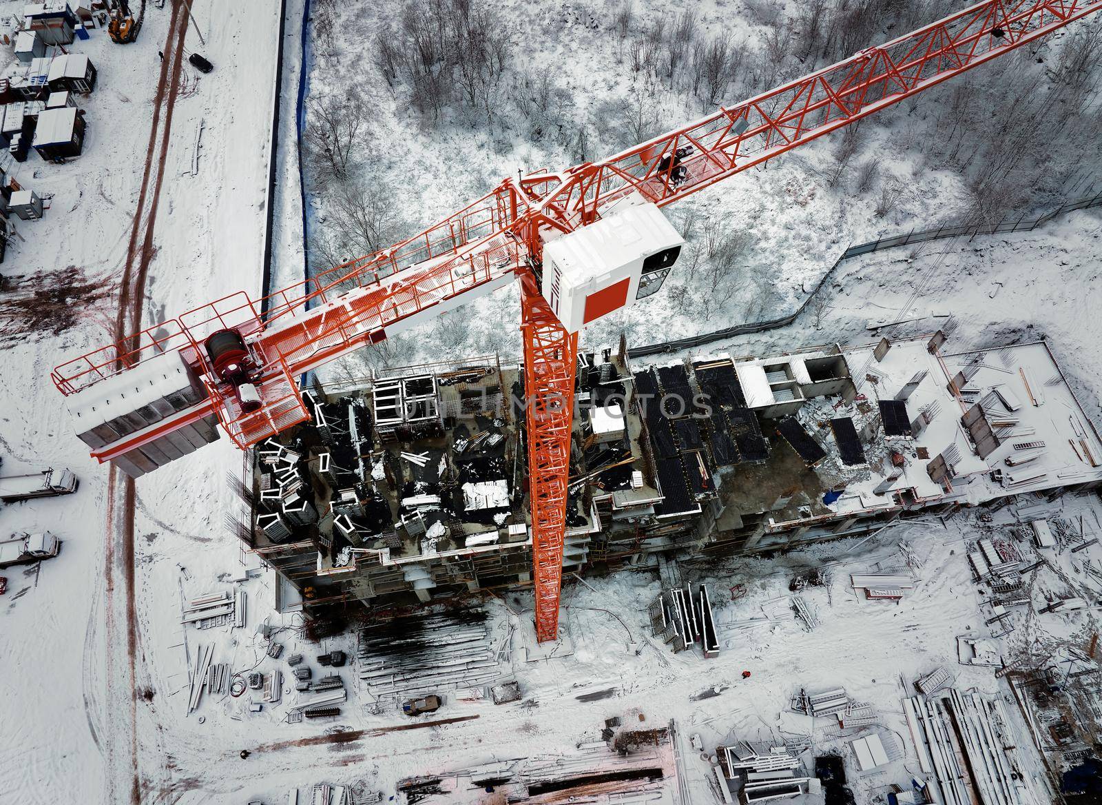 Construction Crane from Above. tower crane on the construction site aerial view. Aerial View Of construction site with crane. Construction workers are building. Top view by EvgeniyQW