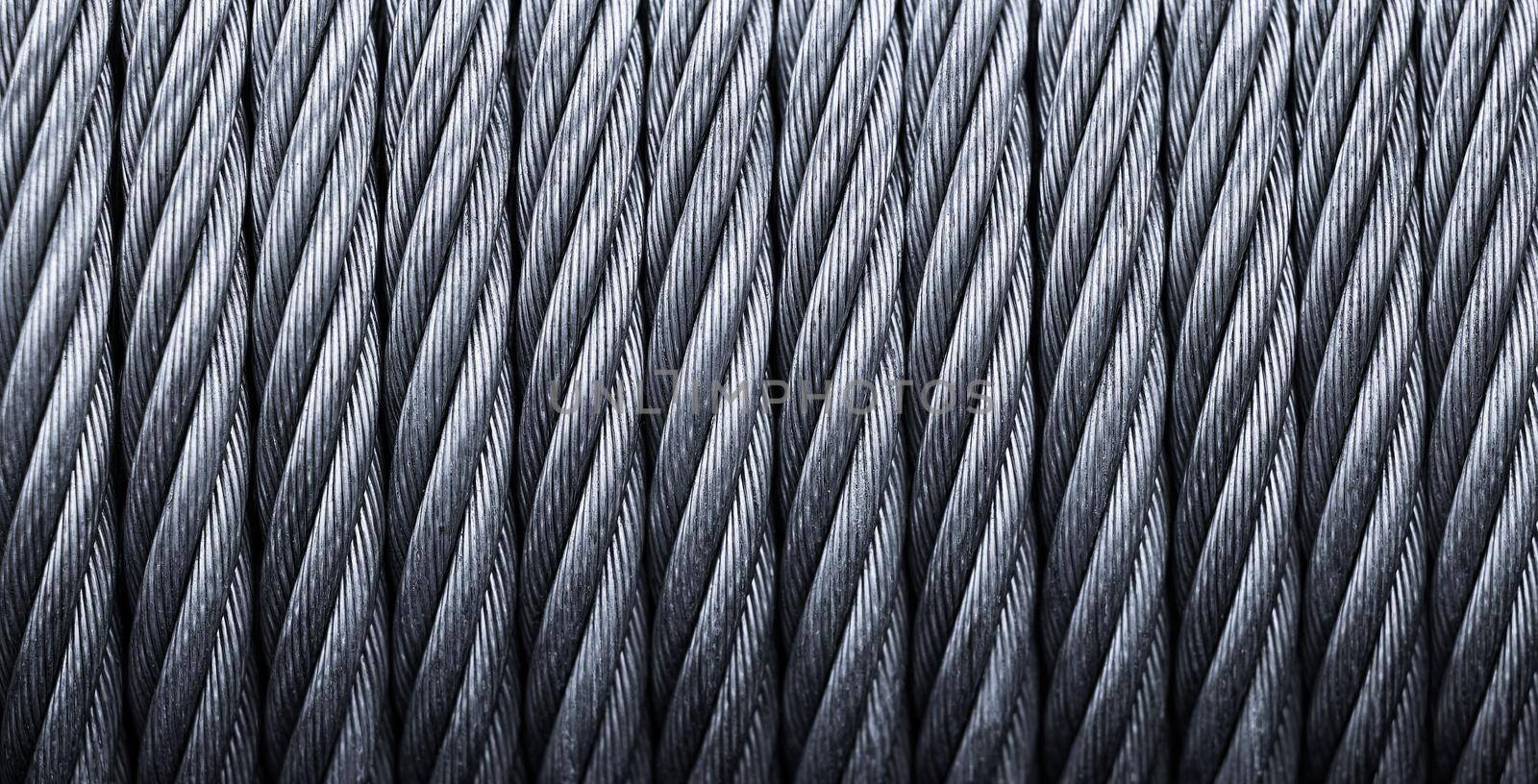 Metal cable winch. Steel rope winch close-up. Strong still background.