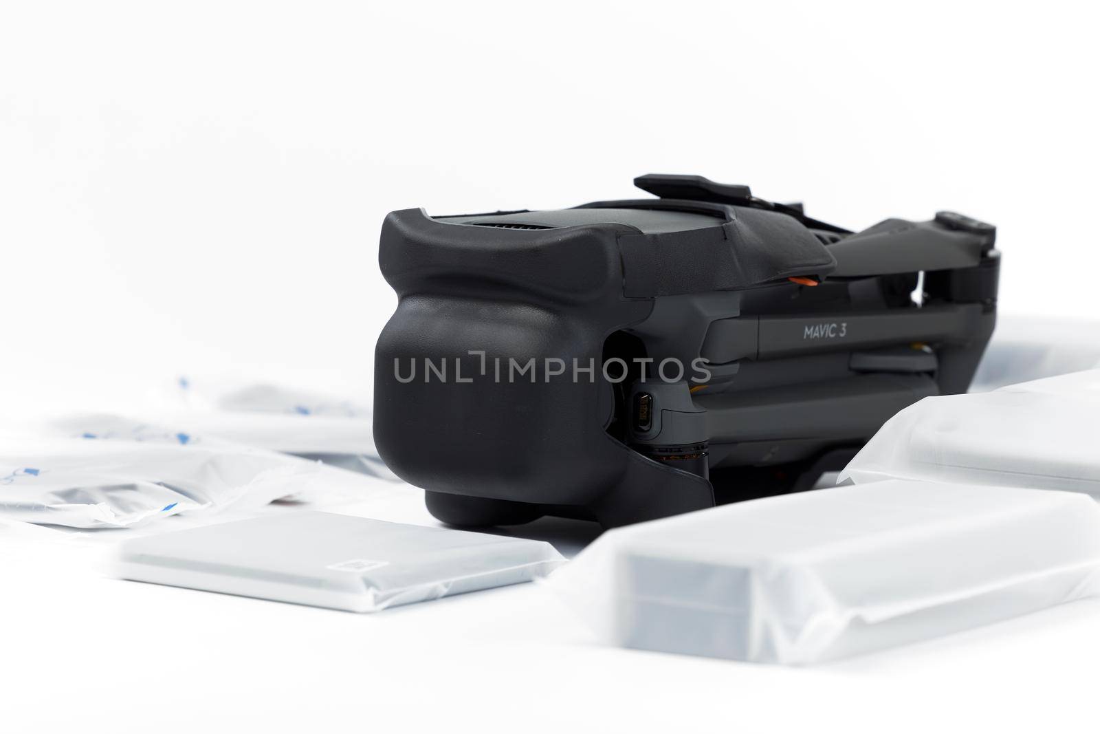 New DJI Mavic 3 drone on a white background when unpacking. Parts of the delivery set in the original packaging. DJI world leader developer and manufacturers in UAV. 17.12.2021, Rostov region, Russia by EvgeniyQW