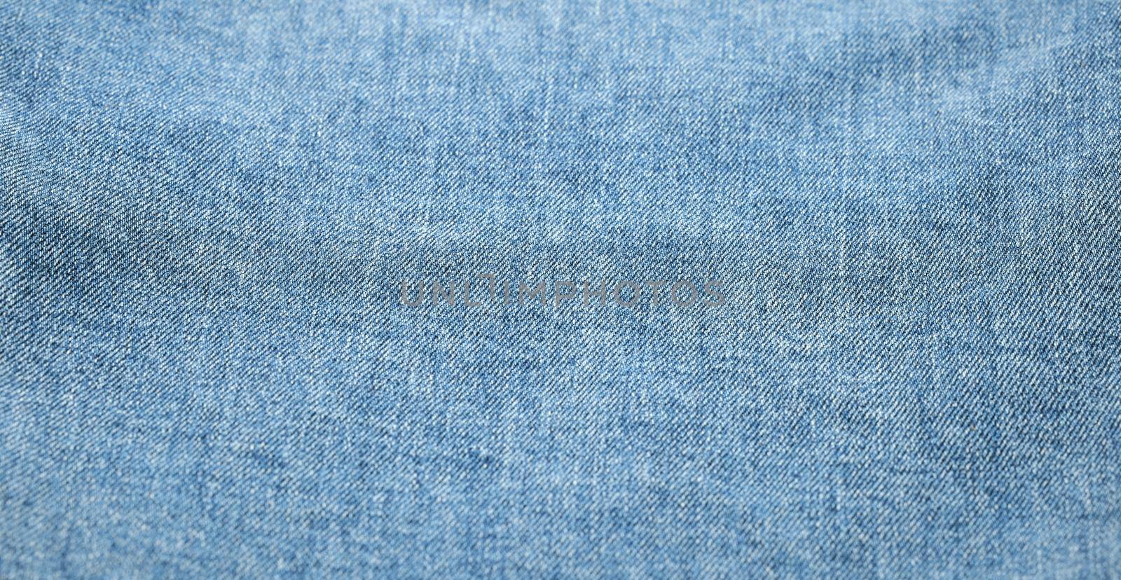 Blue jeans background and texture. Close up of blue jeans background. Denim texture by EvgeniyQW