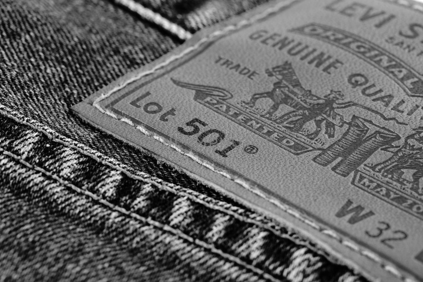 Close up of the details of new LEVI'S 501 Jeans. Seams and denim texture close-up. Classic jeans model. LEVI'S is a brand name of Levi Strauss and Co, founded in 1853. 31.12.2021, Rostov, Russia by EvgeniyQW