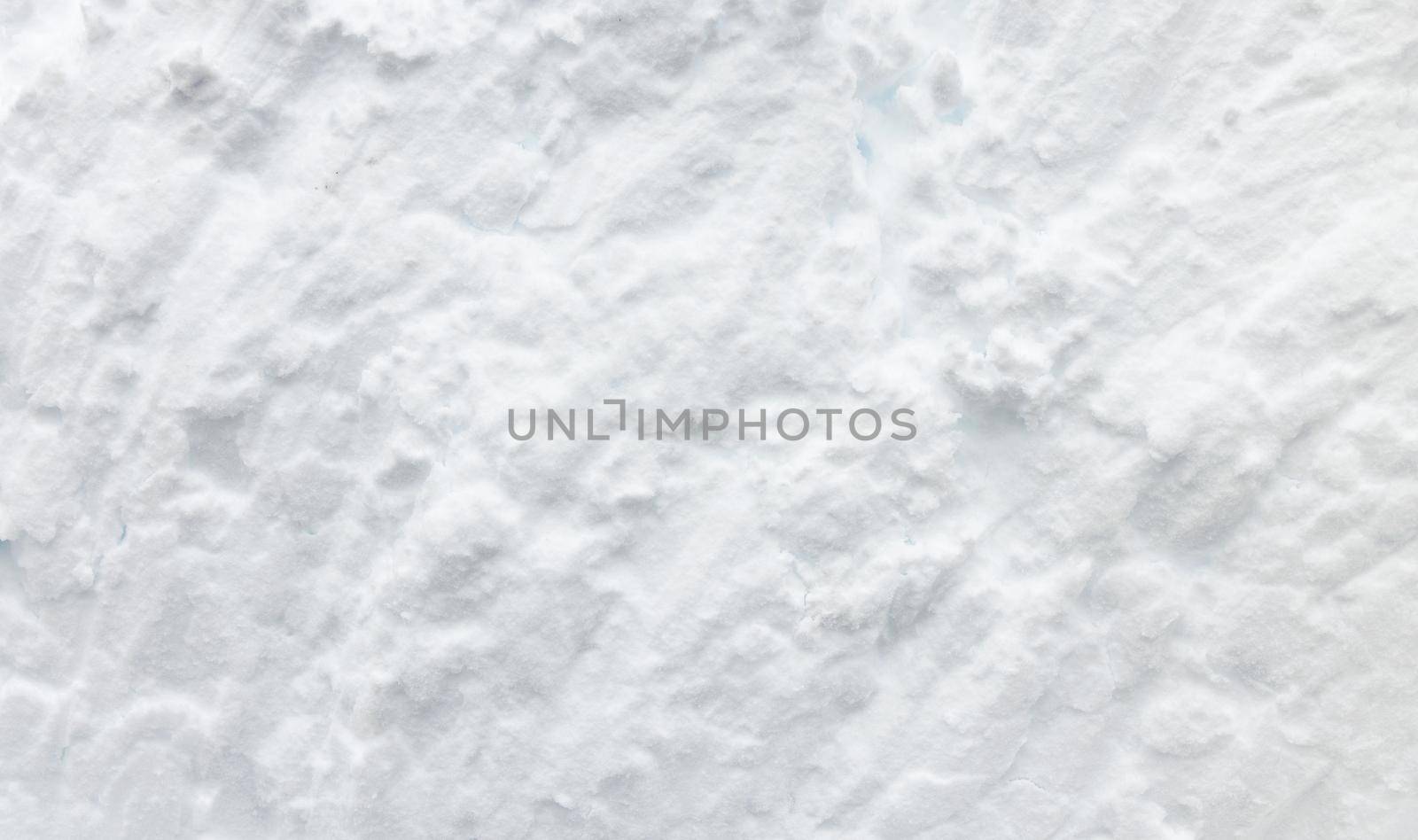 Wall of snow. Snowdrift surface, Winter background. The texture of snow removed with a bucket. Removed compressed snow by EvgeniyQW