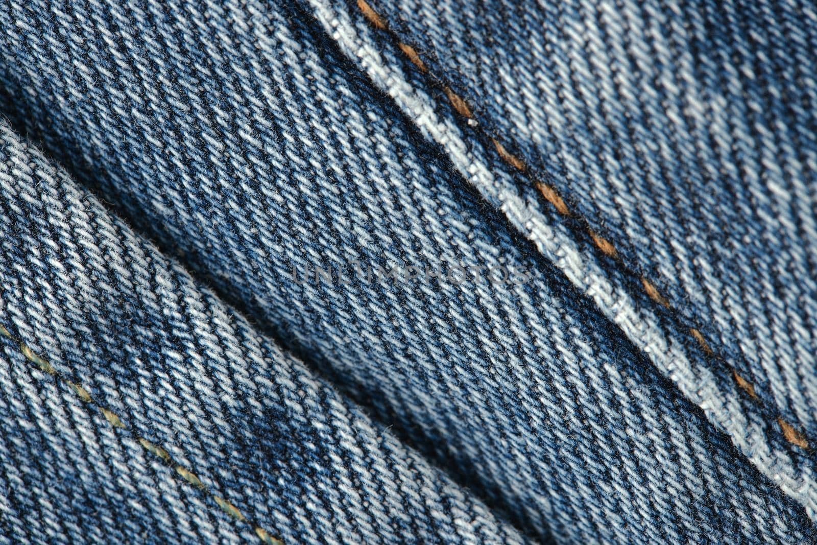 Seams on jeans close-up. Stitching on denim. Close up of blue jeans background. Denim texture.