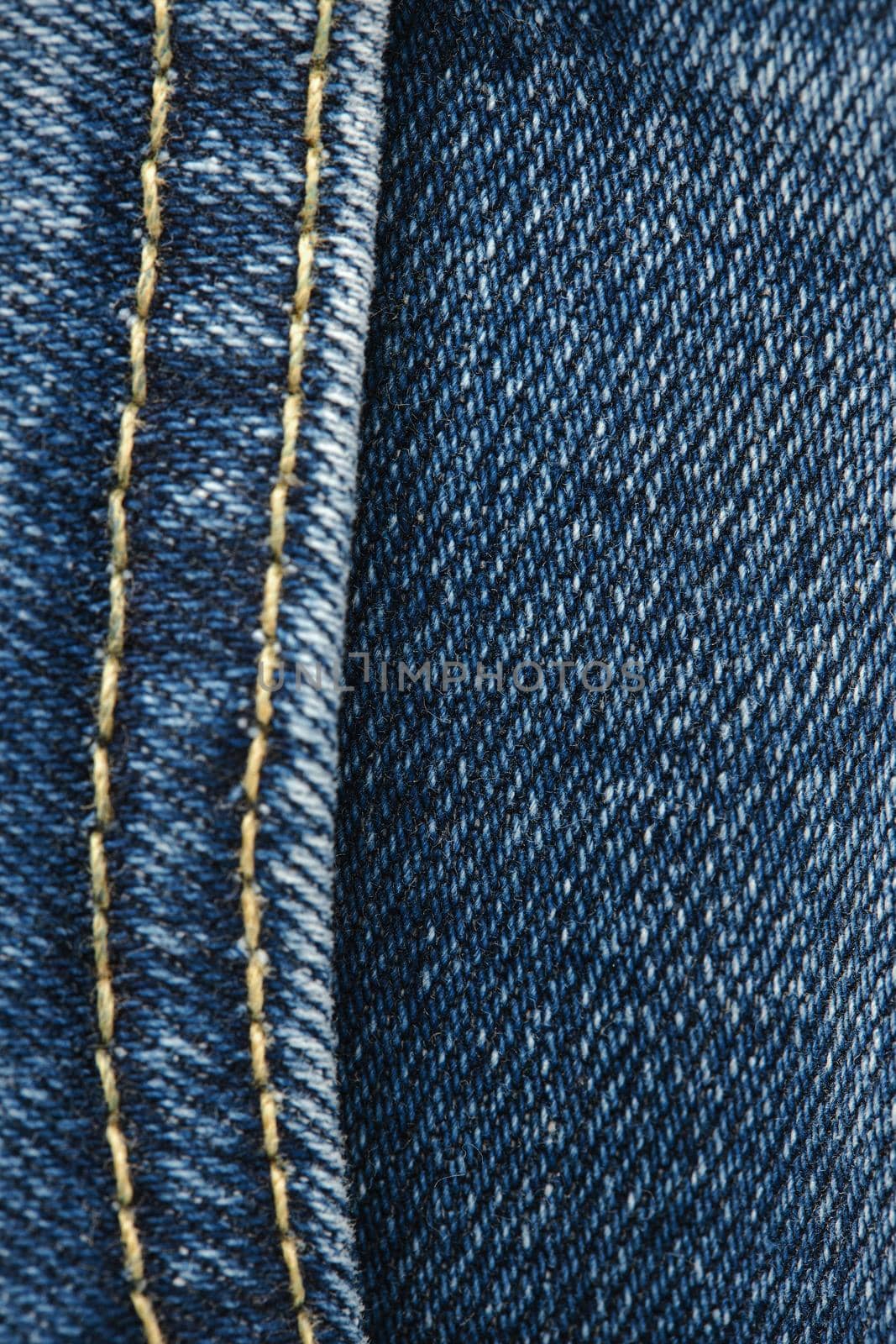 Seams on jeans close-up. Stitching on denim. Close up of blue jeans background. Denim texture by EvgeniyQW