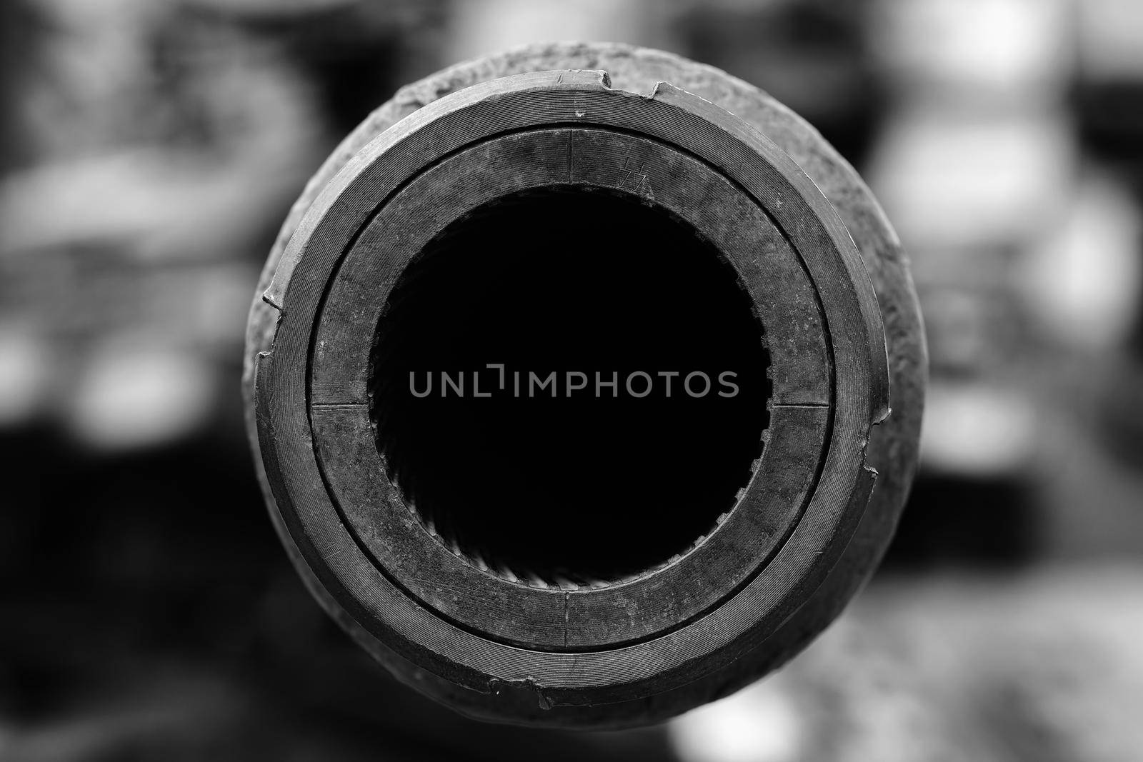 A big gun. The rifled gun of the tank. Close-up of a tank gun barrel with rifling. Abstract background of the armed conflict by EvgeniyQW