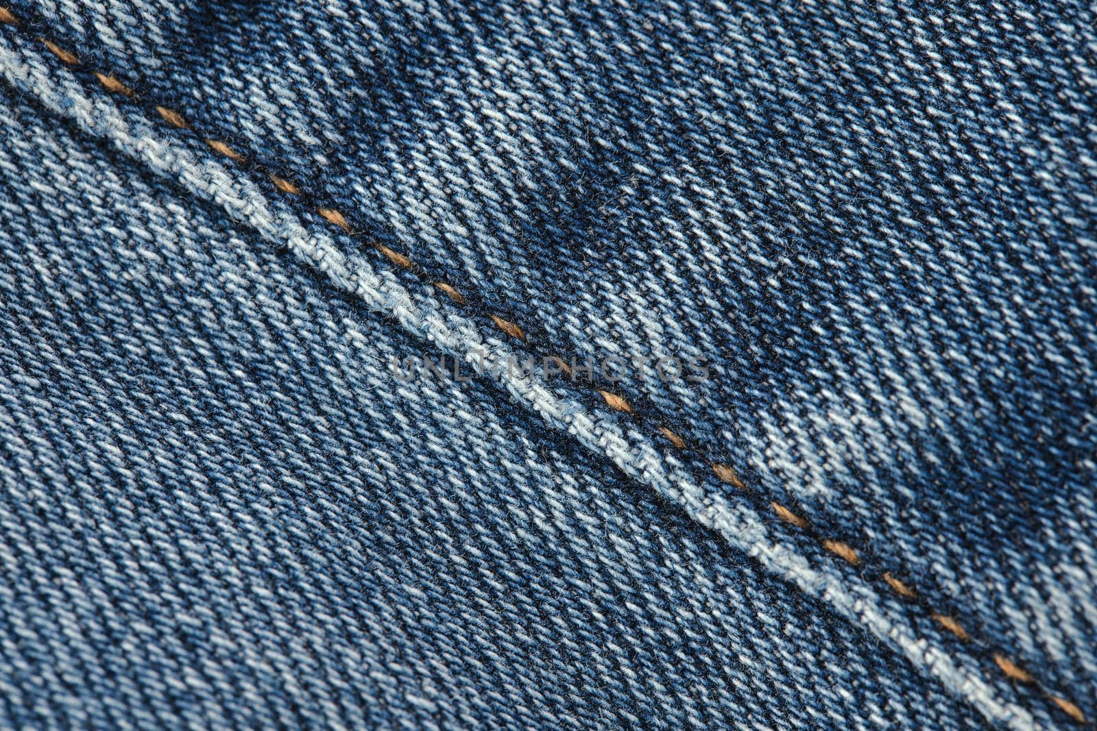 Seams on jeans close-up. Stitching on denim. Close up of blue jeans background. Denim texture by EvgeniyQW