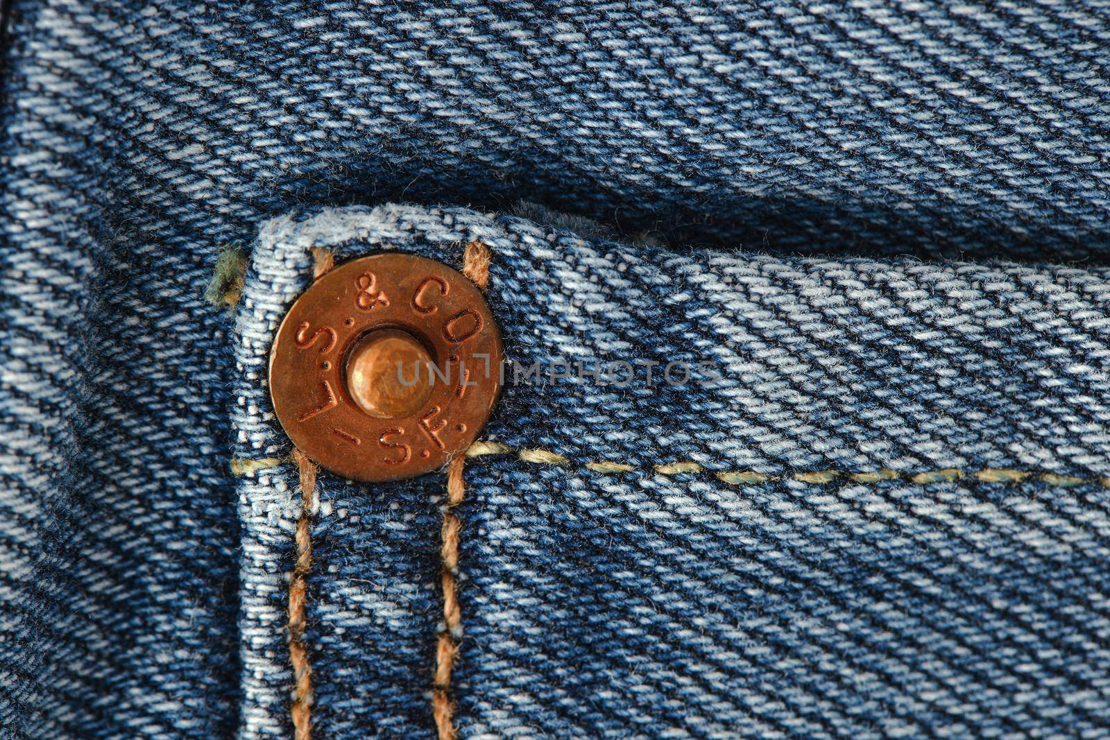 Close up of the details of new LEVI'S 501 Jeans. Seams and denim texture close-up. Classic jeans model. LEVI'S is a brand name of Levi Strauss and Co, founded in 1853. 31.12.2021, Rostov, Russia by EvgeniyQW