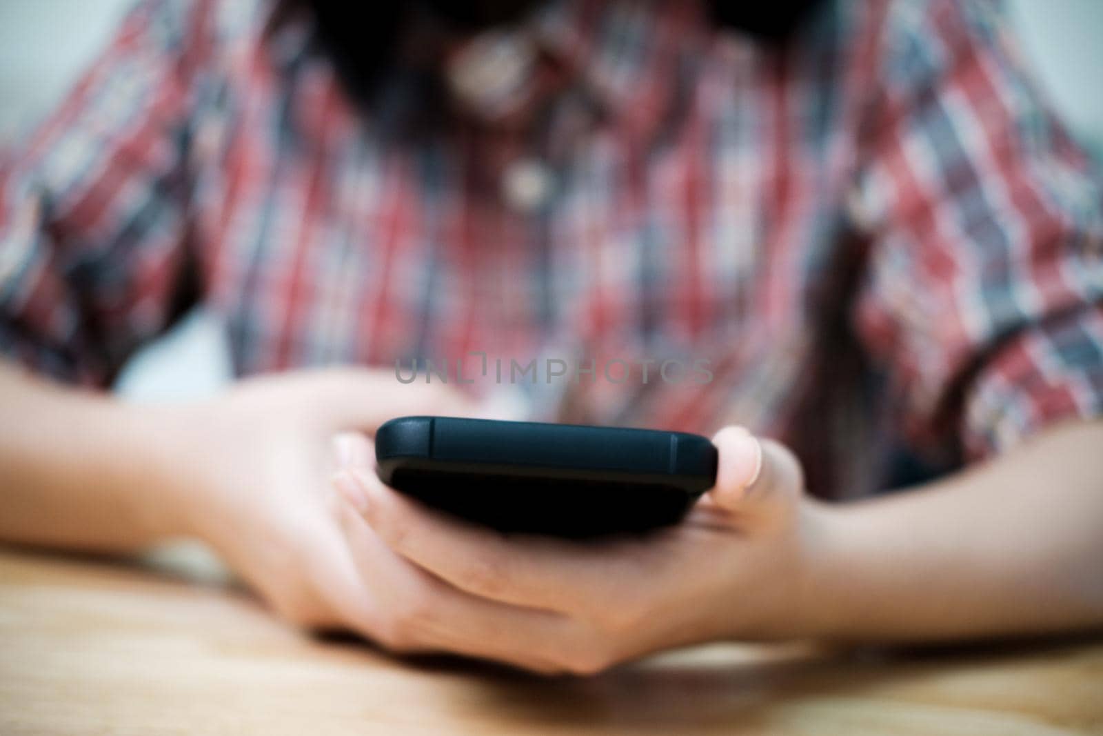 Young man using mobile phone. Using online connect technology for business, education and communication.