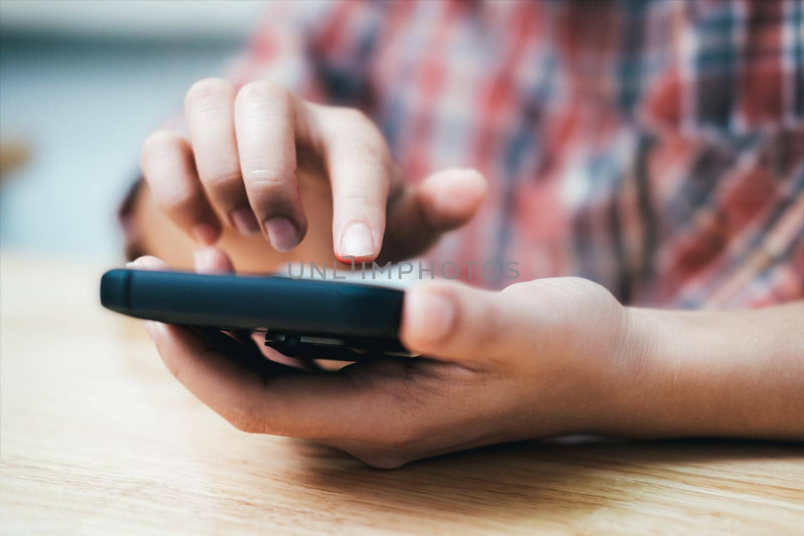 Young man using mobile phone. Using online connect technology for business, education and communication.