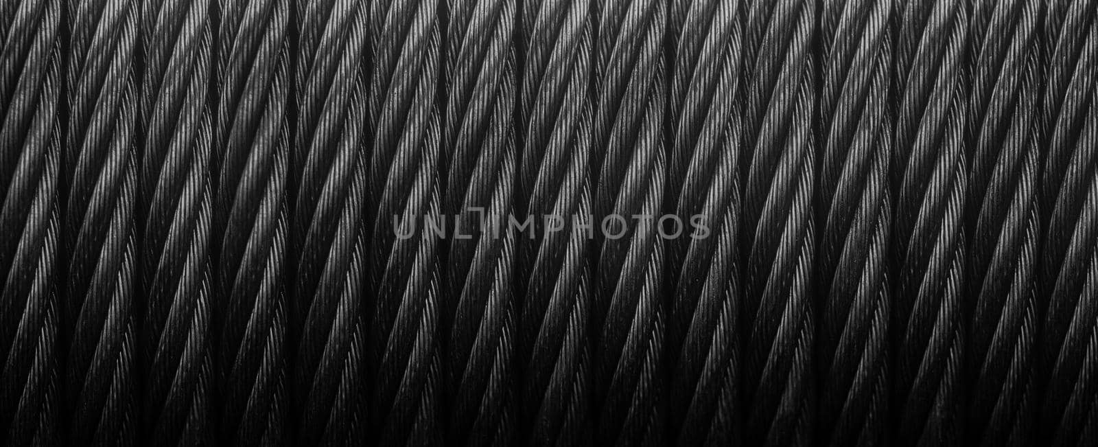 Metal cable winch. Black Steel rope winch close-up. Strong still background by EvgeniyQW
