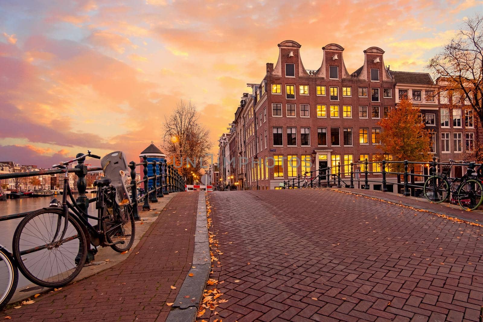 City scenic from Amsterdam at the Amstel in the Netherlands at sunset by devy