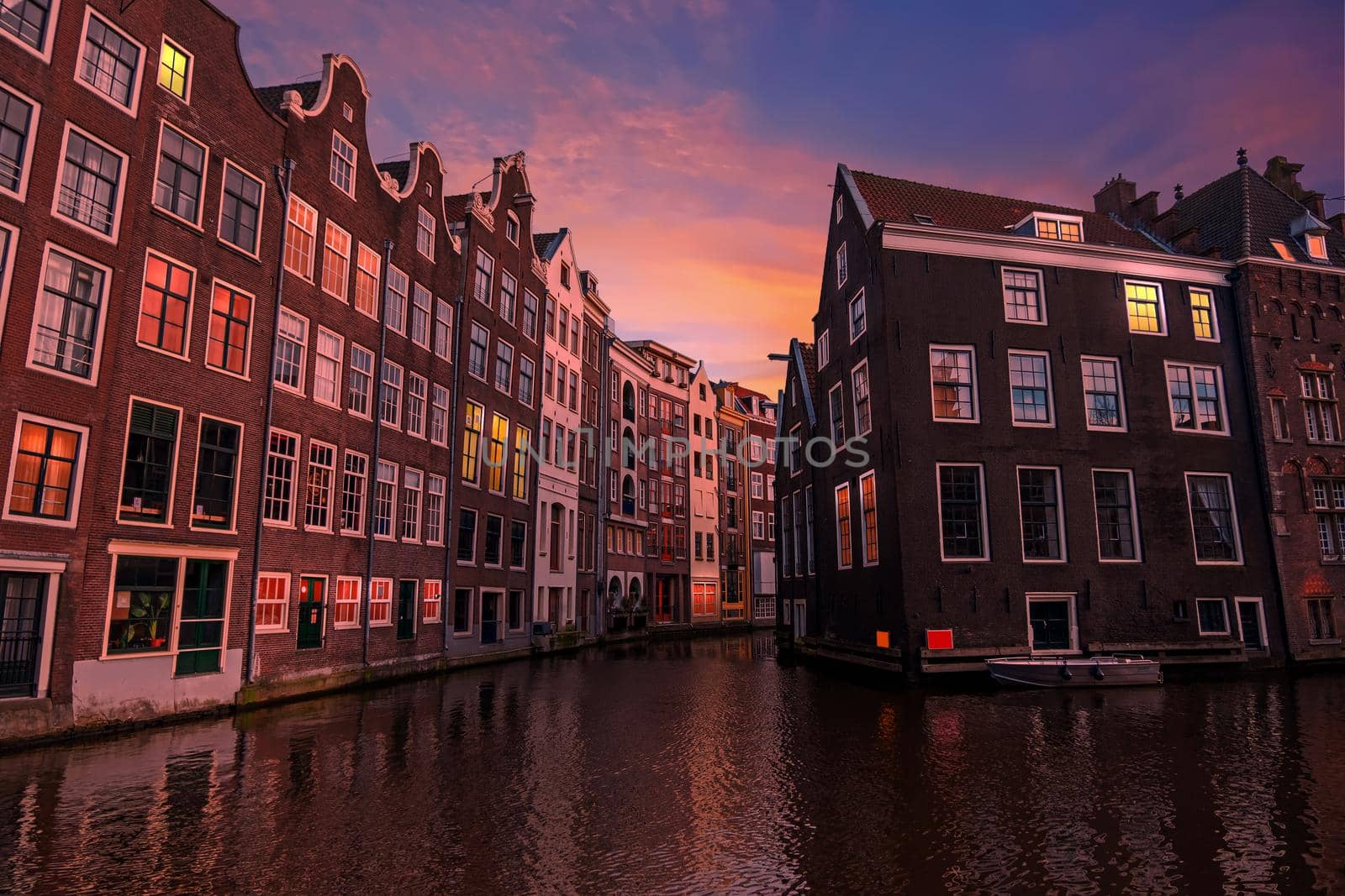 Traditional houses in the city center from Amsterdam in the Netherlands at sunset