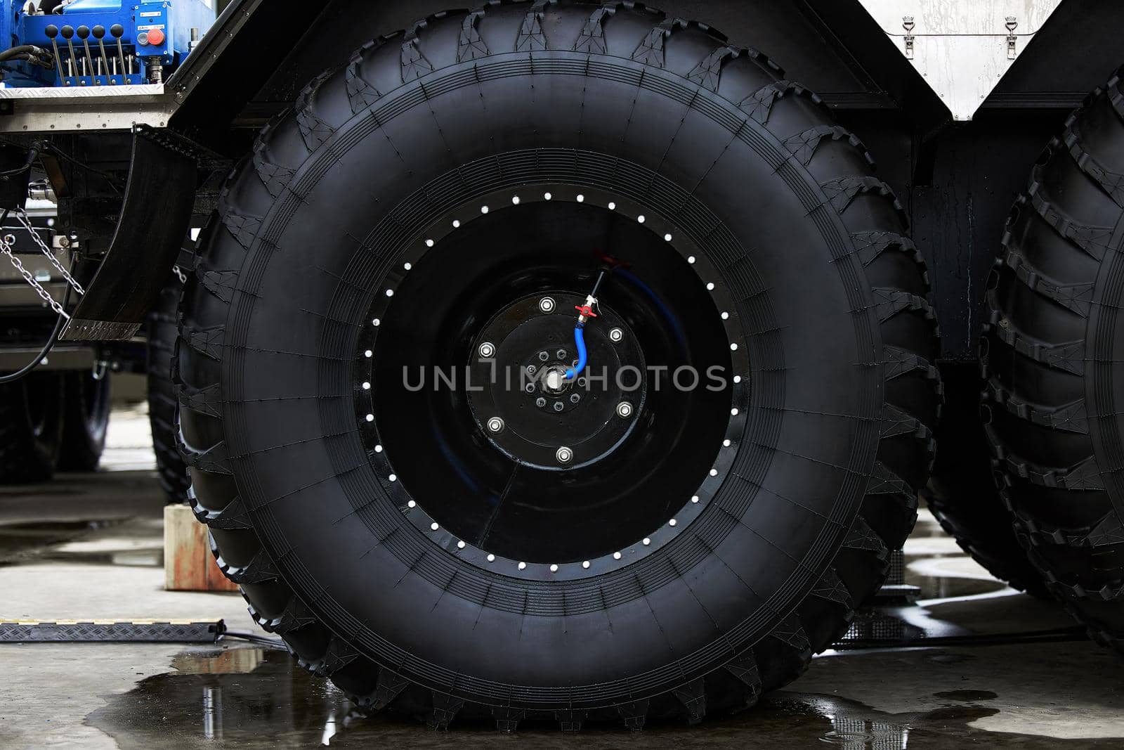 Low pressure tires, with automatic tire pumping system. Extreme patency. Giant Wheels of an all-terrain vehicle. ATV monster car.